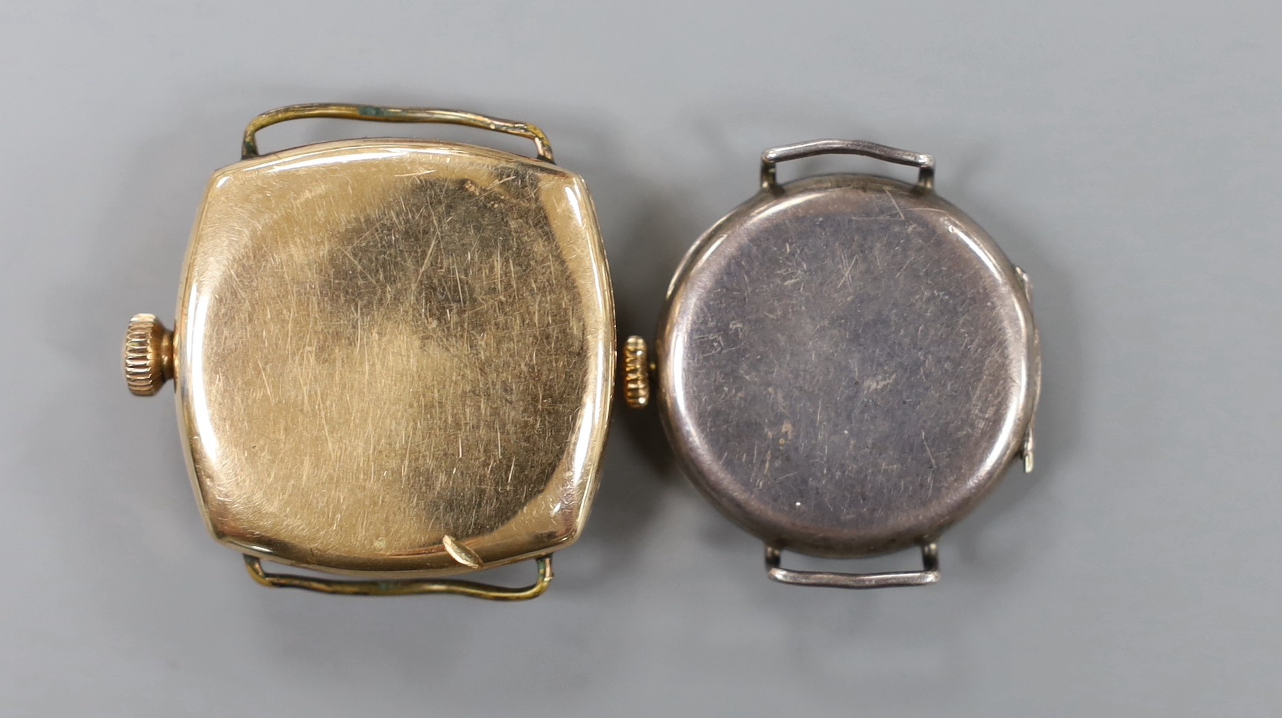A gentleman's gold plated Waltham manual wind wrist watch and a silver manual wind wrist watch, both without straps.
